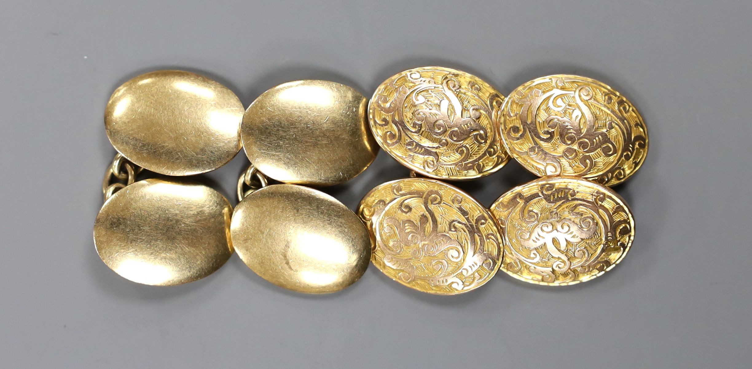 Two pairs of 9ct gold oval cufflinks including engraved, 26.7 grams.